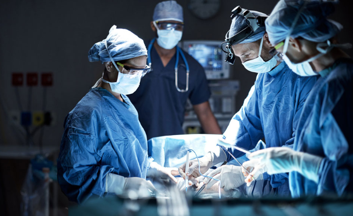 Medical professionals working in an operating room