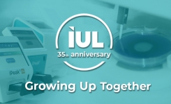 IUL logo against a background of microbiology instruments